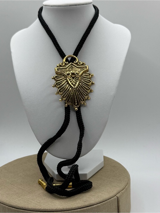 Jewelry - Gold Shield Pendant Bolo Tie Necklace - Black Cord